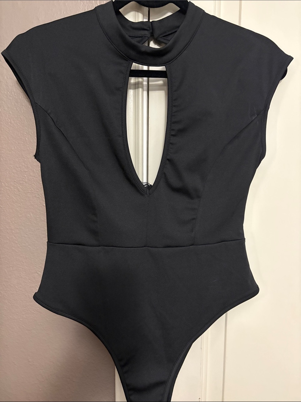 Black Sleeveless bodysuit with high mock neck Keyhole